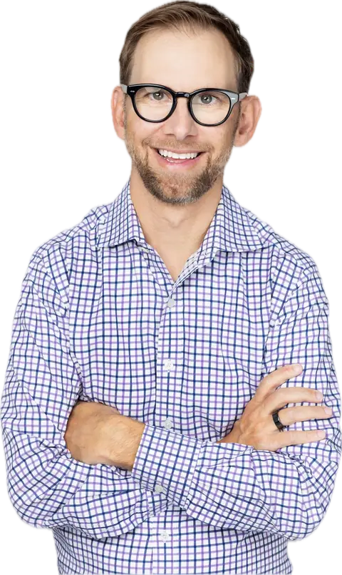 Michael Kutcher, arms crossed, smiling