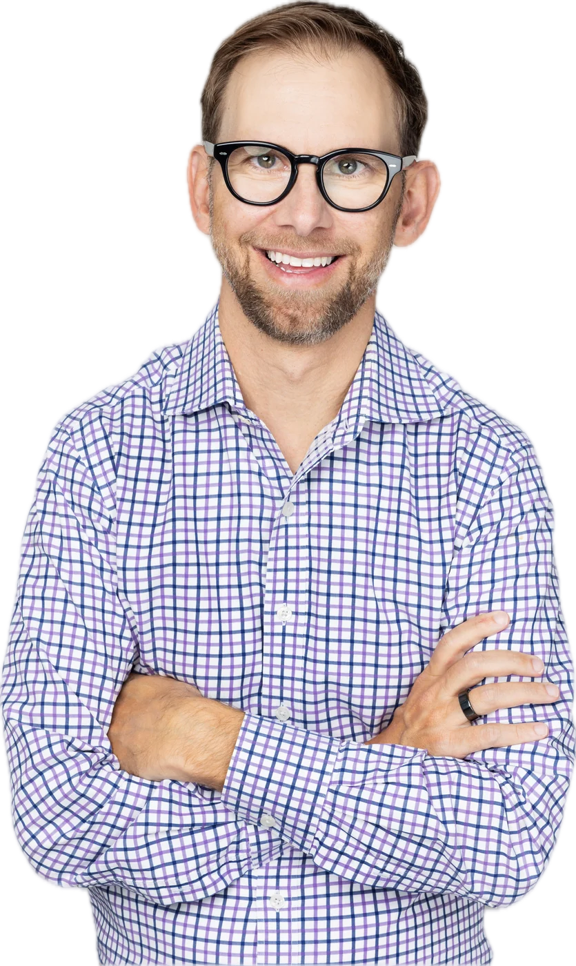 Michael Kutcher, arms crossed, smiling